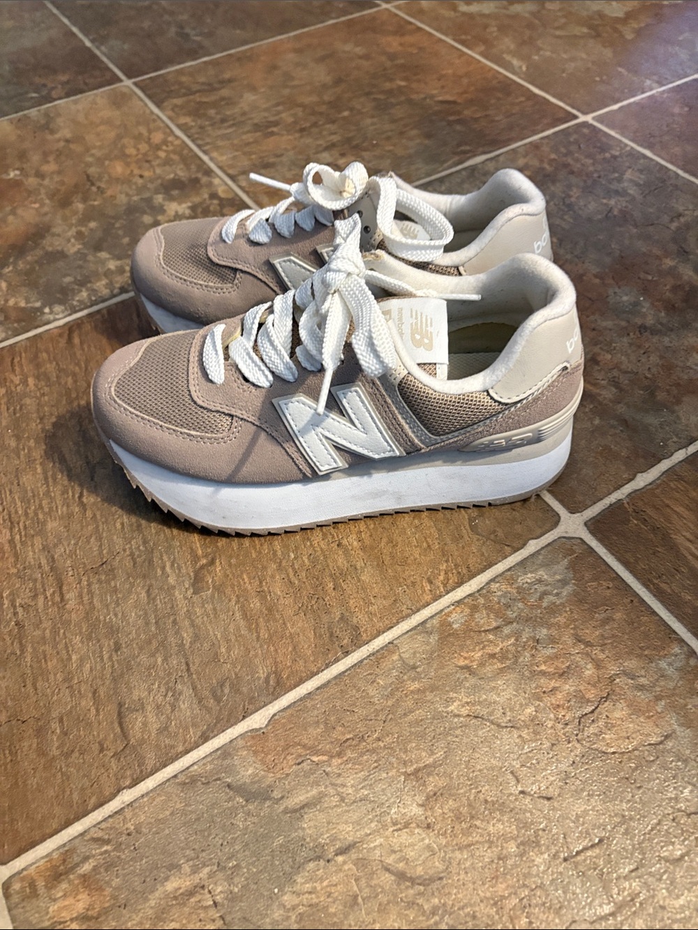 New Balance women’s Light Beige and White Platform Sneakers